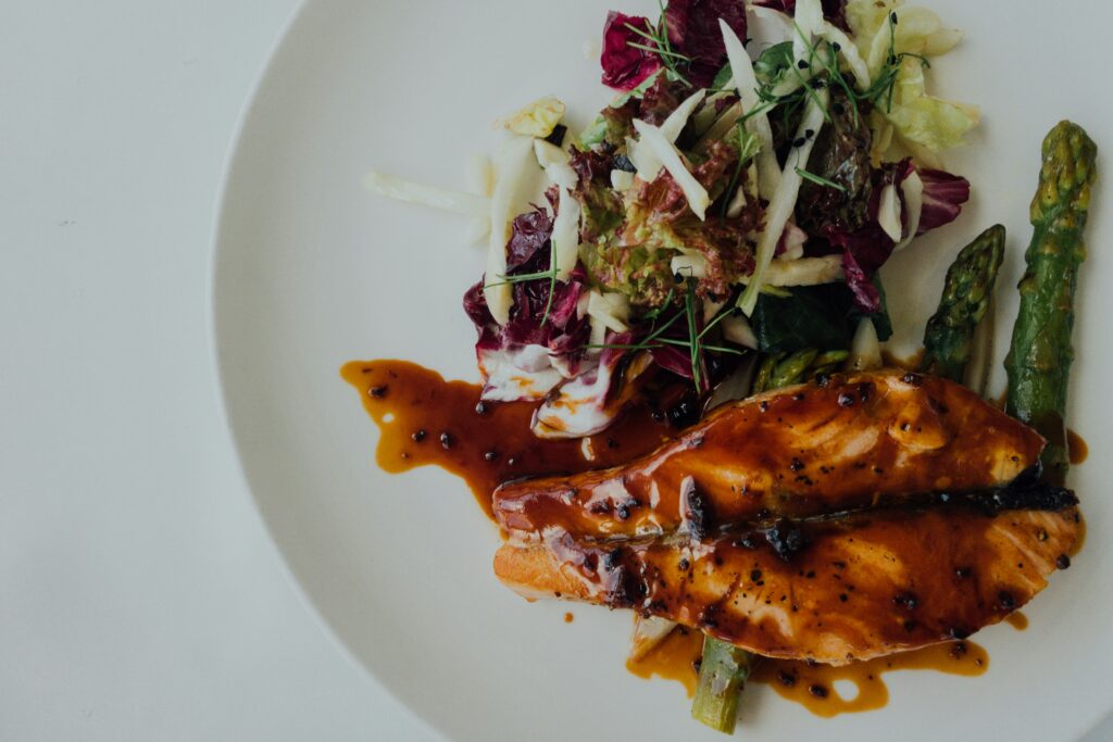 lemon pepper salmon on white plate